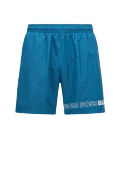 Shop Hugo Boss Swim Shorts With Repeat Logos In Blue