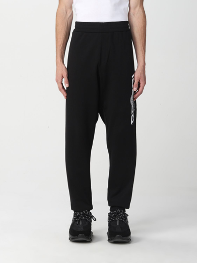 Shop Versace Greca Jogging Trousers In Black
