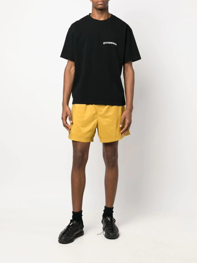 Pleasures Embossed Logo Bermuda Shorts In Yellow