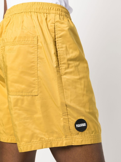 Pleasures Embossed Logo Bermuda Shorts In Yellow