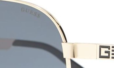 Shop Guess 62mm Aviator Sunglasses In Gold / Smoke