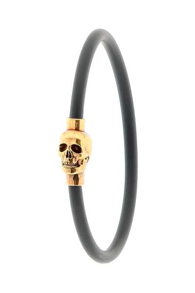 Shop Alexander Mcqueen Skull Rubber Bracelet In Black,gold