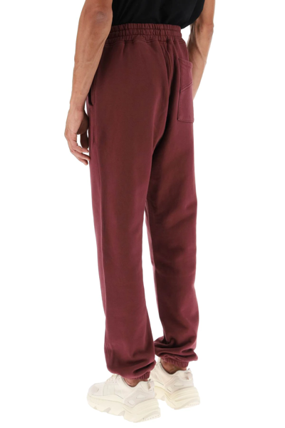 Shop Rhude Logo-embroidered Sweatpants In Red