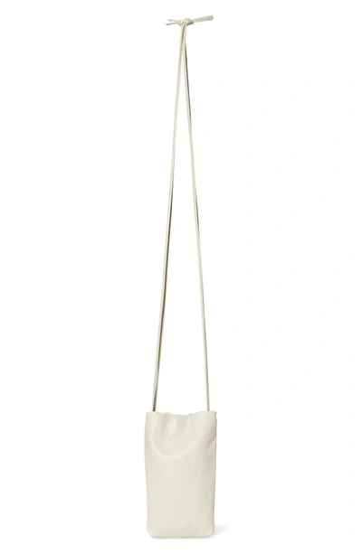 Shop The Row Ruched Leather Phone Crossbody Bag In Ivory