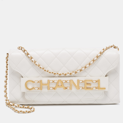 CHANEL. White quilted fabric clutch bag, identical inter…