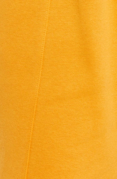 Shop Nike Sportswear Essential Fleece Shorts In Light Curry/ White