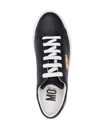 Shop Moschino Leather Low-top Sneakers In Schwarz