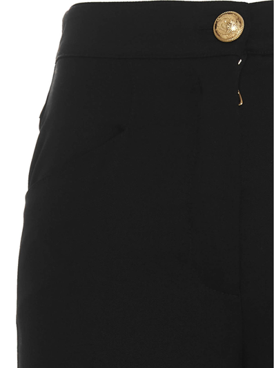 Shop Balmain Logo Button Trousers In Black