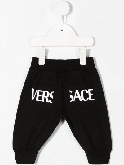 Shop Versace Greca-print Stretch-cotton Track-pants In Black