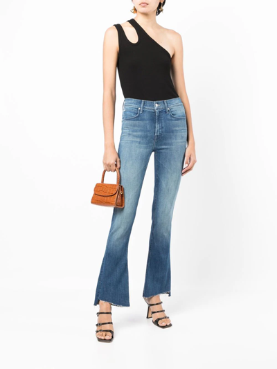 Shop Mother The Runaway Step Flared Jeans In Blue