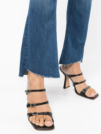 Shop Mother The Runaway Step Flared Jeans In Blue