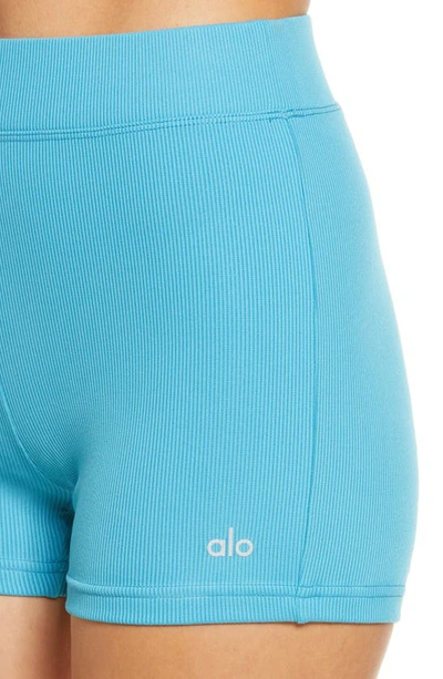 Shop Alo Yoga Goddess Rib High Waist Bike Shorts In Blue Splash