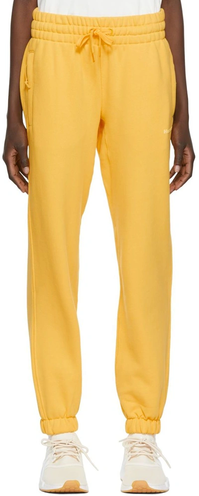 Shop Adidas X Humanrace By Pharrell Williams Yellow Humanrace Basics Lounge Pants In Bold Gold