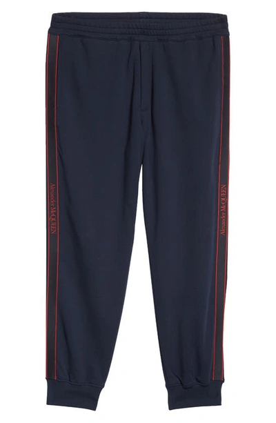 Shop Alexander Mcqueen Tapered Logo Cotton Joggers In Ink/ Mix