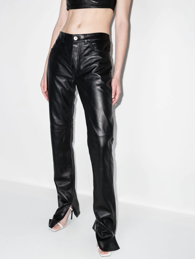 Shop Attico Split Bottom Leather Trousers In Schwarz