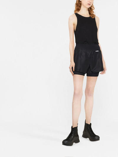 Jil Sander Logo Tech Layered Running Shorts In Schwarz