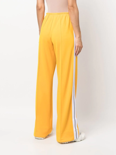 Shop Palm Angels Logo-print Loose-fit Track Pants In Gelb