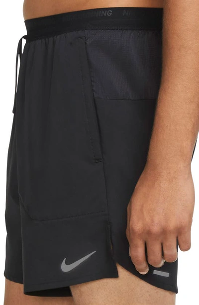 Shop Nike Dri-fit Stride Unlined Running Shorts In Black/ Reflective Silver