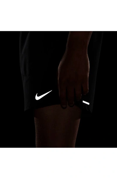Shop Nike Dri-fit Stride Unlined Running Shorts In Black/ Reflective Silver