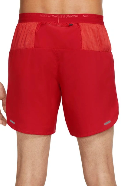 Shop Nike Dri-fit Stride Unlined Running Shorts In Red/ Black/ Reflective Silv