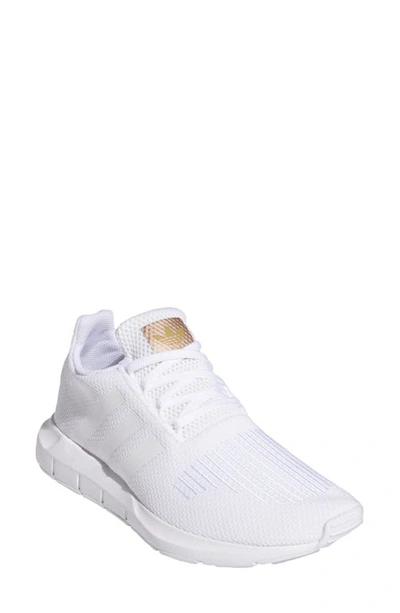Shop Adidas Originals Gender Inclusive Swift Run Sneaker In White/ White/ White