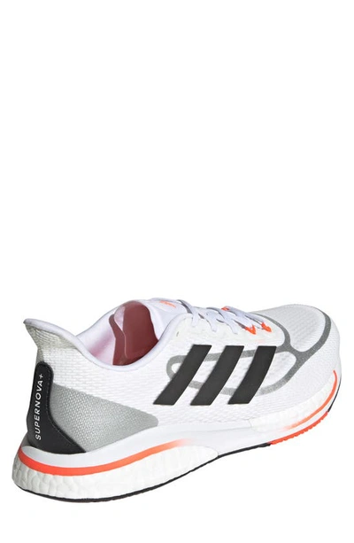 Shop Adidas Originals Supernova Running Shoe In Ftwr White/black/solar Red
