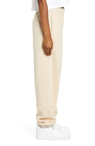 Shop Nike Sportswear Essential Fleece Pants In Sanddrift/ White