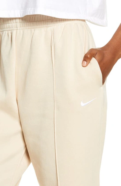 Shop Nike Sportswear Essential Fleece Pants In Sanddrift/ White