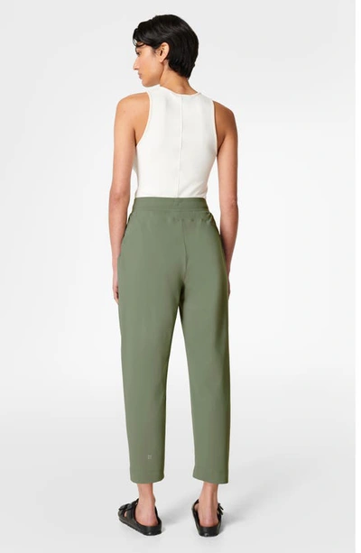 Shop Sweaty Betty Explorer Tapered Athletic Pants In Heath Green