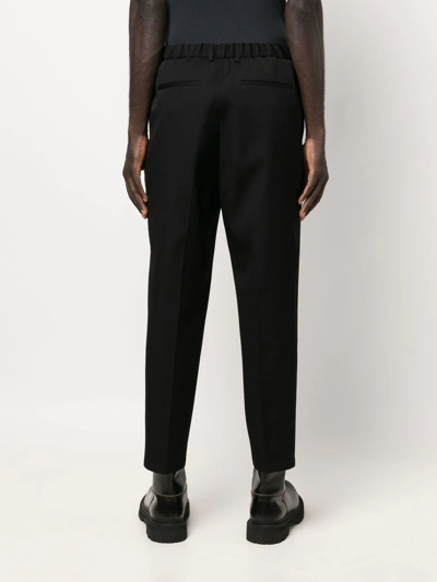Jil Sander Wool Logo Trousers Tapered Leg In Schwarz