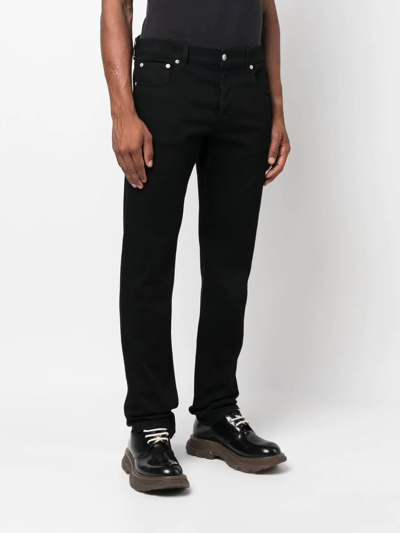 Shop Alexander Mcqueen Straight-leg Logo Jeans In Black