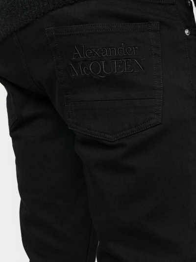 Shop Alexander Mcqueen Straight-leg Logo Jeans In Black