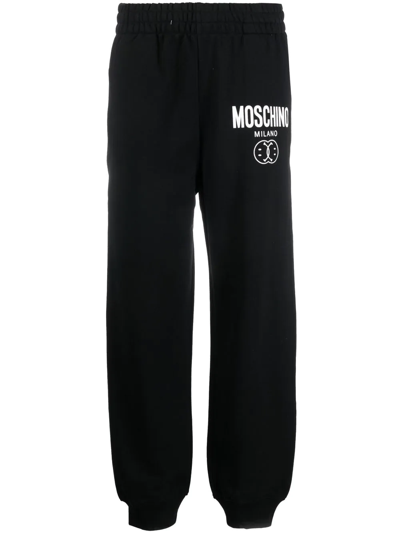 Shop Moschino Logo-print Track Pants In Schwarz