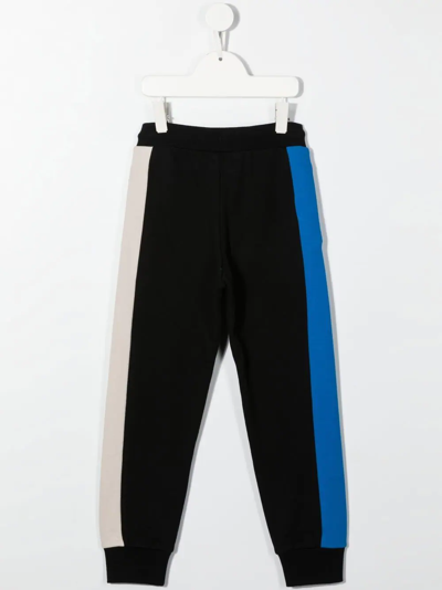 Shop Dkny Logo-print Tapered Joggers In Black