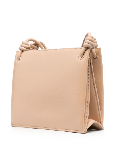 Shop Jil Sander Engraved-logo Leather Crossbody Bag In Neutrals