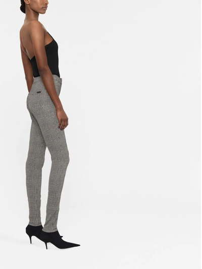Saint Laurent Black And White Check-patterned Skinny Trousers In Black