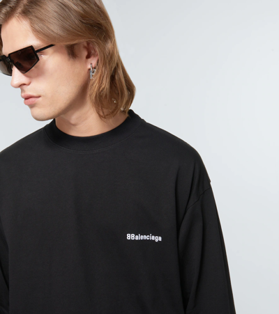 Shop Balenciaga Logo Cotton Jersey Sweater In Black/white