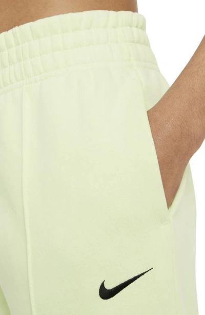Shop Nike Sportswear Essential Fleece Pants In Lime Ice/ Black