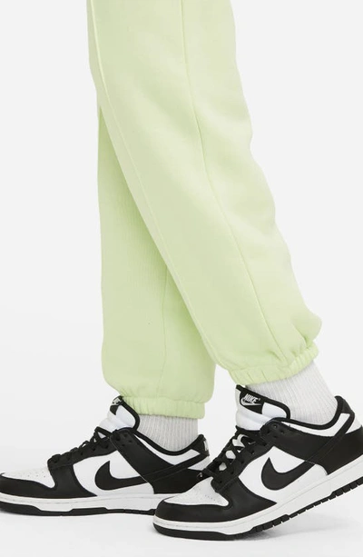 Shop Nike Sportswear Essential Fleece Pants In Lime Ice/ Black