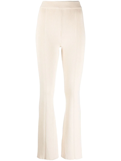 Shop Aeron Ribbed-knit Flared Trousers In Neutrals