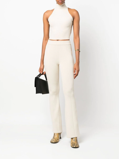 Shop Aeron Ribbed-knit Flared Trousers In Neutrals