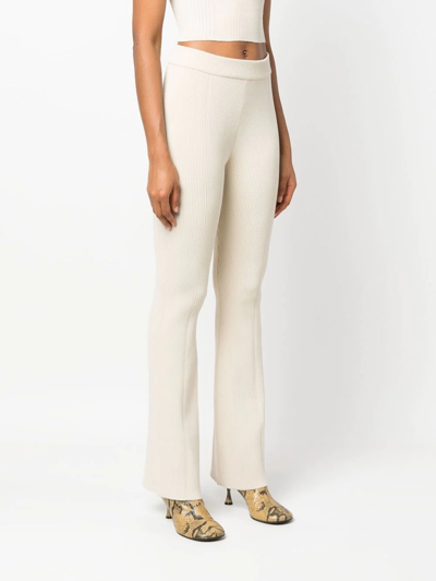 Shop Aeron Ribbed-knit Flared Trousers In Neutrals