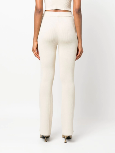 Shop Aeron Ribbed-knit Flared Trousers In Neutrals