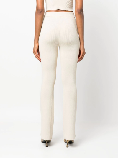 Aeron Ribbed-knit Flared Trousers In Neutrals