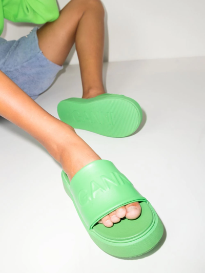 Shop Ganni Logo-embossed Slide Sandals In Grün