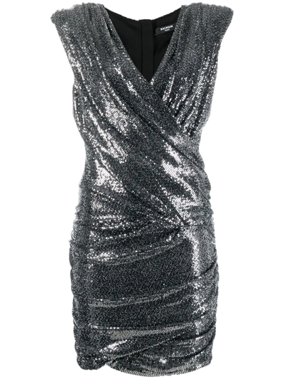 Shop Balmain Embellished Wrap Mini Dress In Schwarz