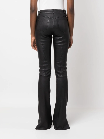 Shop Drome Flared Leather Trousers In Schwarz