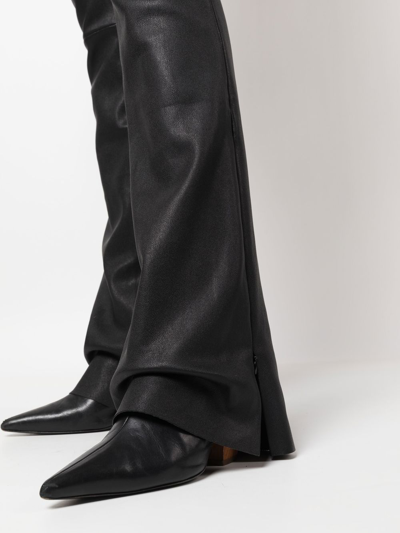 Shop Drome Flared Leather Trousers In Schwarz