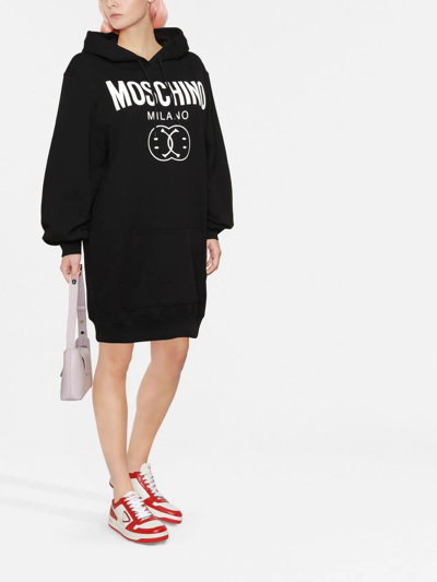 Shop Moschino Logo Print Hooded Dress In Schwarz