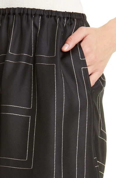 Shop Totême Monogram Pull-on Silk Shorts In Black Monogram